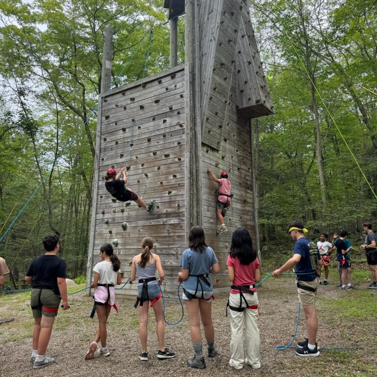 Campers climbing the Climbing Wall.