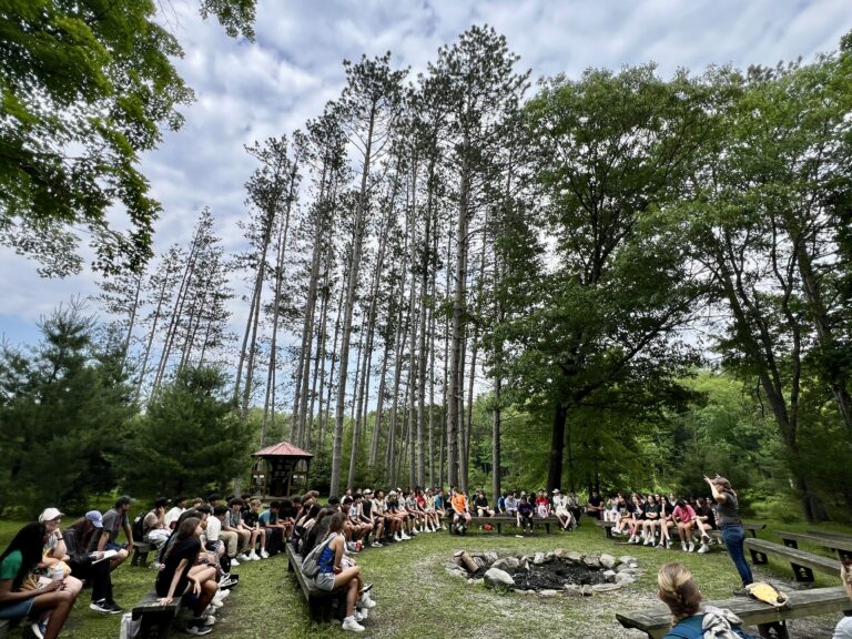 School students gathered around Piney Point.
