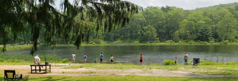People fishing along Lake Wapalanne.